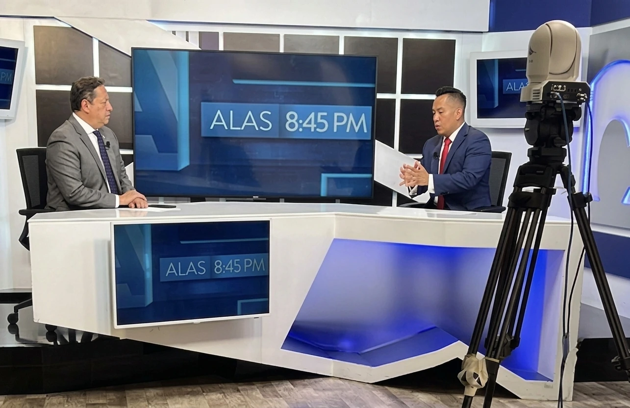 Oscar A. Ischiu appearing with television presenters