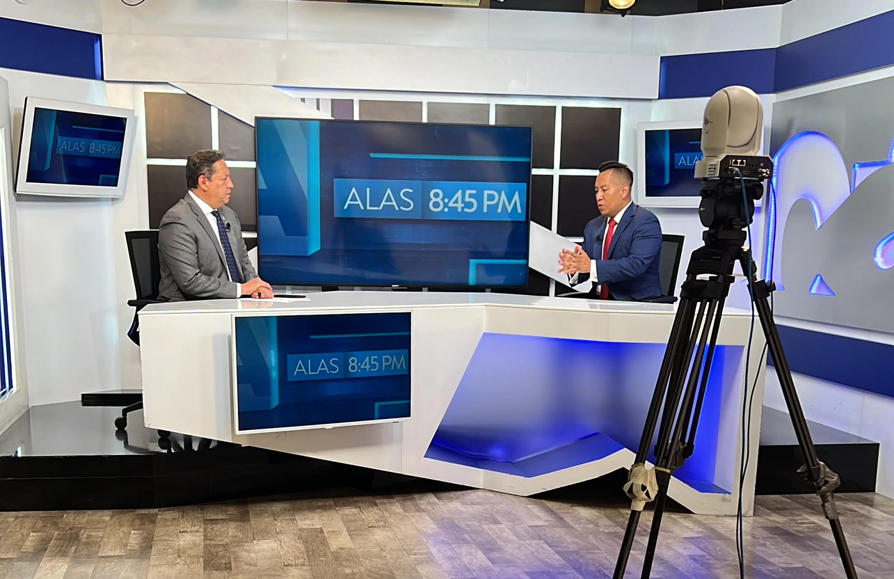 Oscar A. Ischiu appearing with television presenters